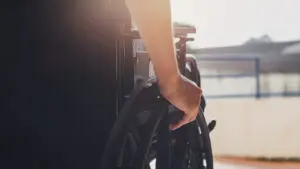 Disabled man sitting in a wheelchair. People with disabilities can access anywhere in public place with wheelchair that make them independent in transportation.